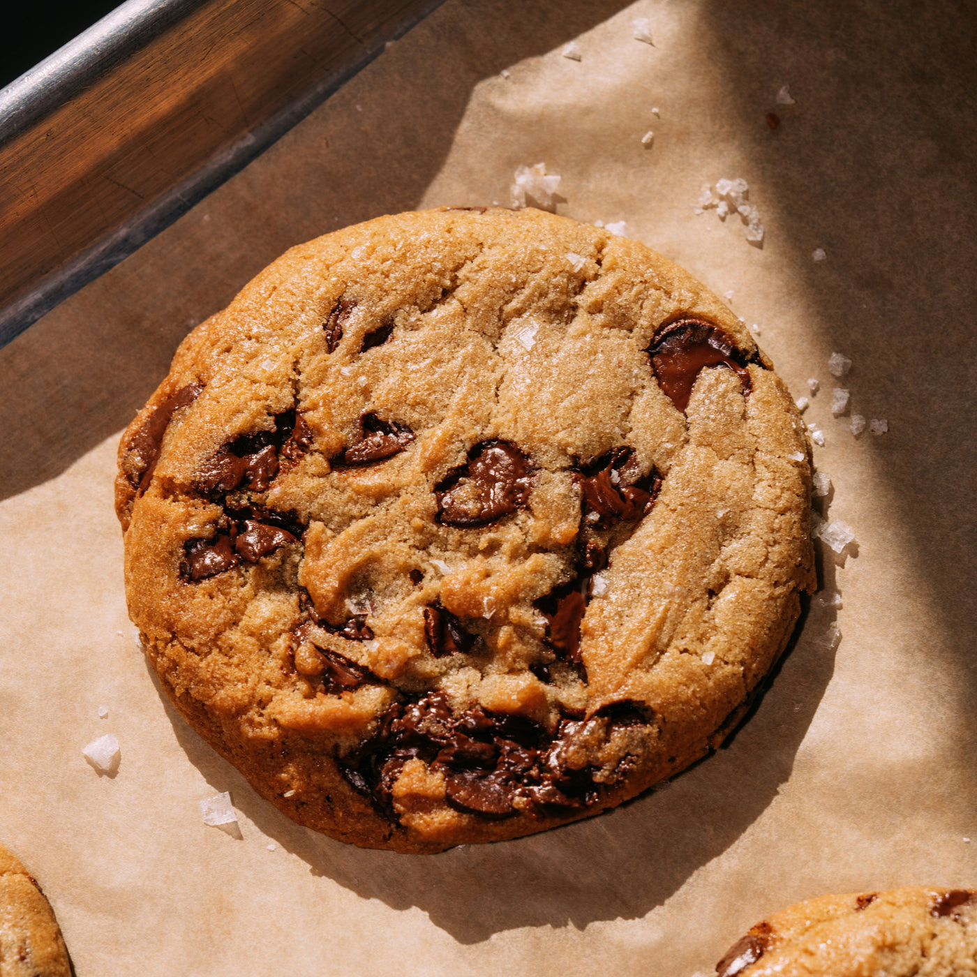 Chocolate chip cookies on a baking sheet with parchment paper